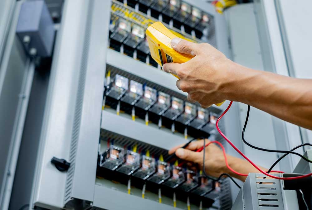 Commercial electrician testing electrical panel systems in Chesapeake VA